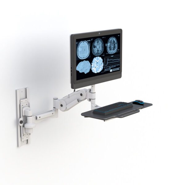 Angled shot demonstrating full swivel range and ergonomic positioning of monitor and keyboard.