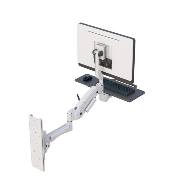 Installed in medical workspace, showcasing space-saving design with tray folded against wall.