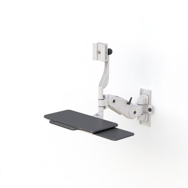Installed in workspace, illustrating space-saving design with tray folded against the wall.