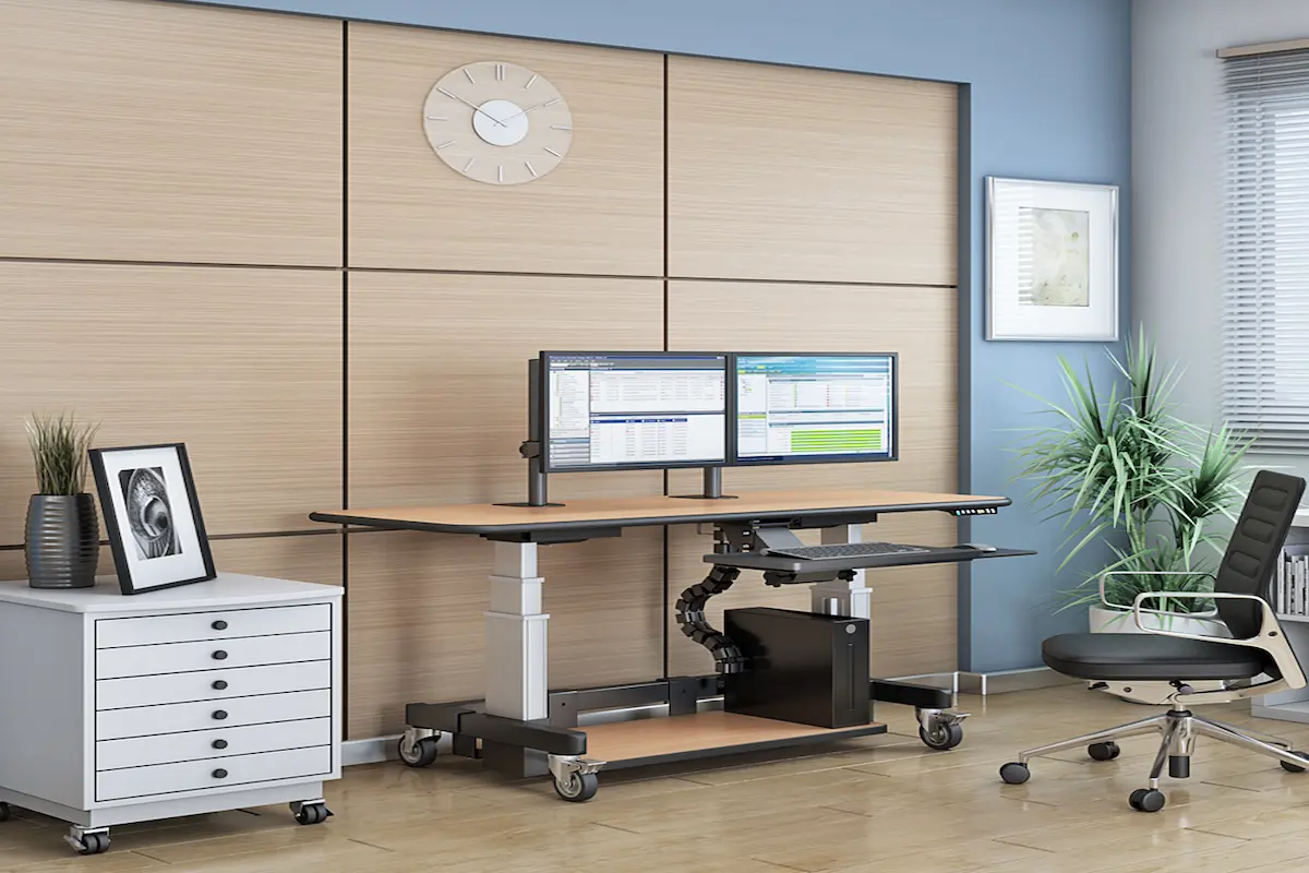 Height adjustable standing desk workstation in a modern office workspace