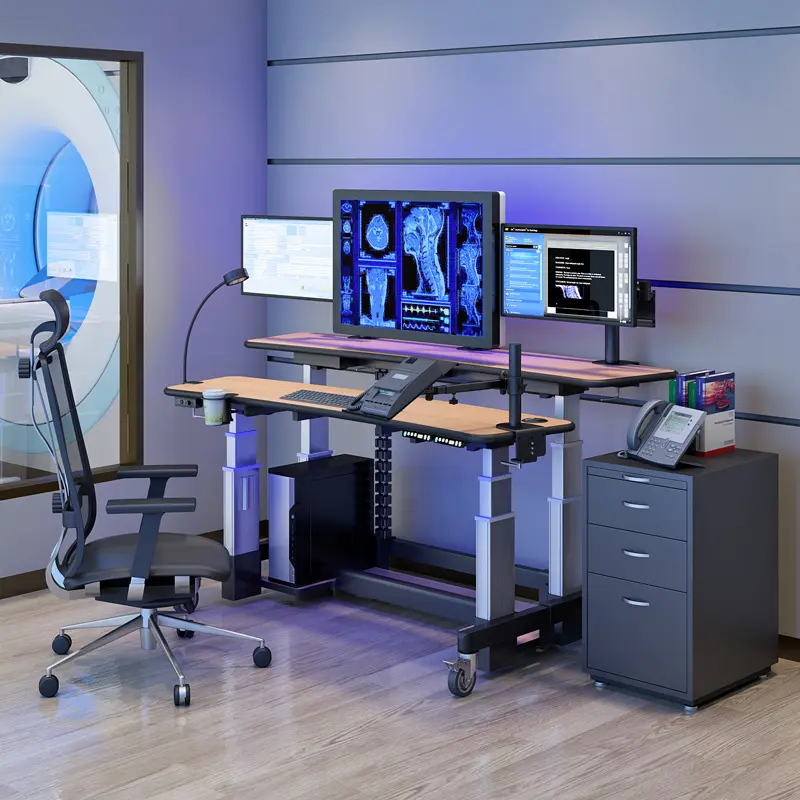 Industrial and medical workstation setup with multiple monitors and ergonomic desks