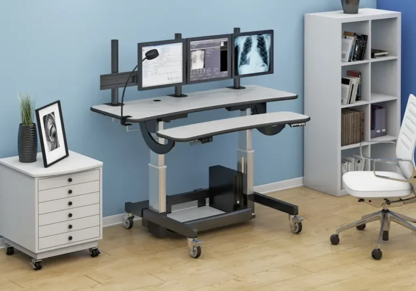 Ergonomic computer workplace ergonomics with adjustable desk and multi-monitor setup